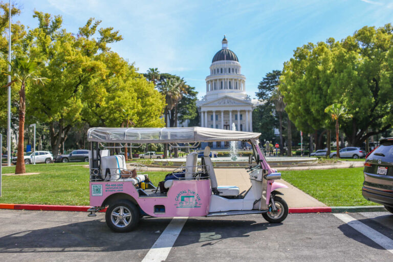 Capital Tuk Tuk parked in front of California State Capitol in Sacramento.