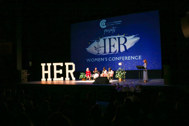 Panel discussion on stage at the HER Women's Conference at the Harris Center in Folsom, Cal