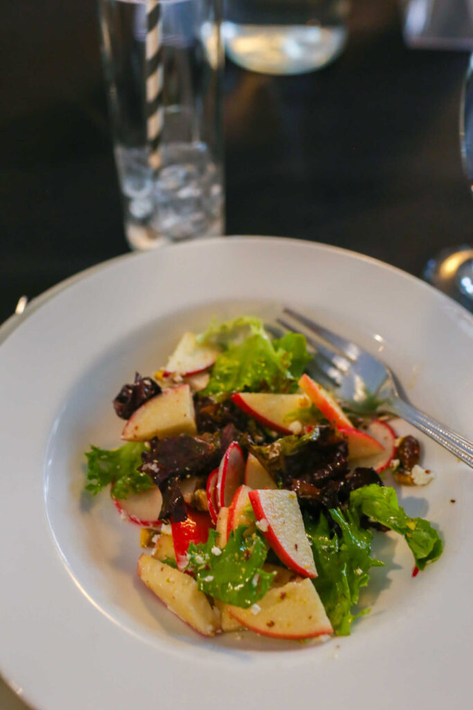 Fresh mixed greens salad with apples and radishes served during a private event at Hook & Ladder Manufacturing Company.