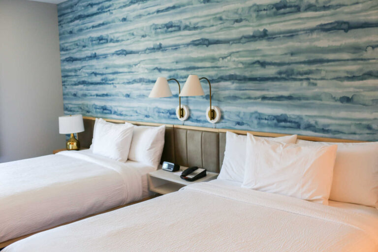 Two queen beds in a spacious guest room at TownePlace Suites by Marriott Sacramento Rancho Cordova.